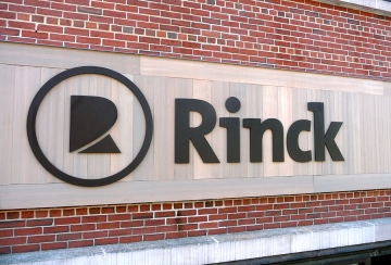 Cut-out anodized aluminum letters for Rinck Advertising