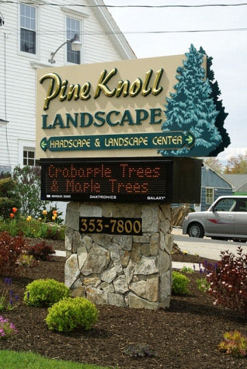 architectural sign with carved letters and electronic message board