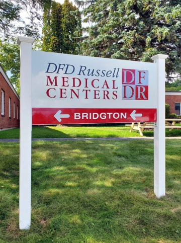 Carved sign for DFD Russell Medical Center in Bridgton