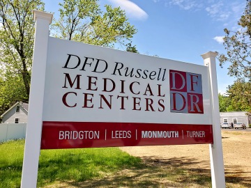 Carved sign for DFD Russell in Monmouth