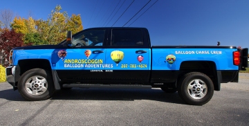 Vinyl lettering and digital prints on balloon chase vehicle